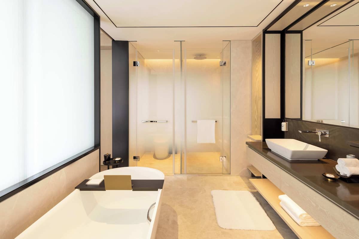 Separate tub and shower, rainfall showerhead, hair dryer, bathrobes