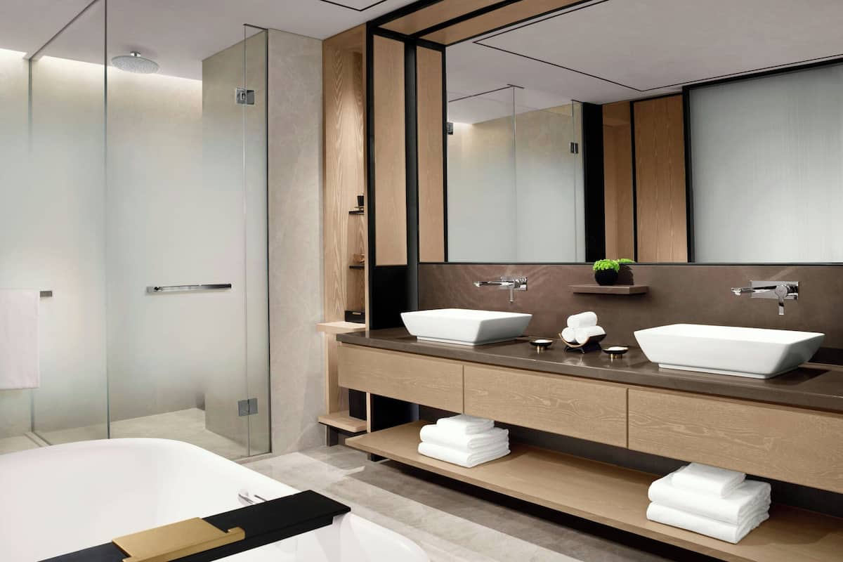 Separate tub and shower, rainfall showerhead, hair dryer, bathrobes