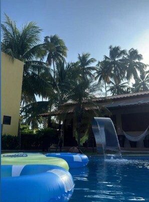 Outdoor pool, open 11:00 AM to 8:00 PM, pool umbrellas, pool loungers