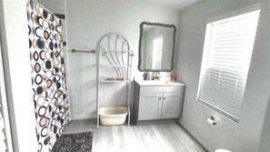 Shower, towels, soap, toilet paper