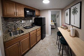 Fridge, microwave, stovetop, coffee/tea maker