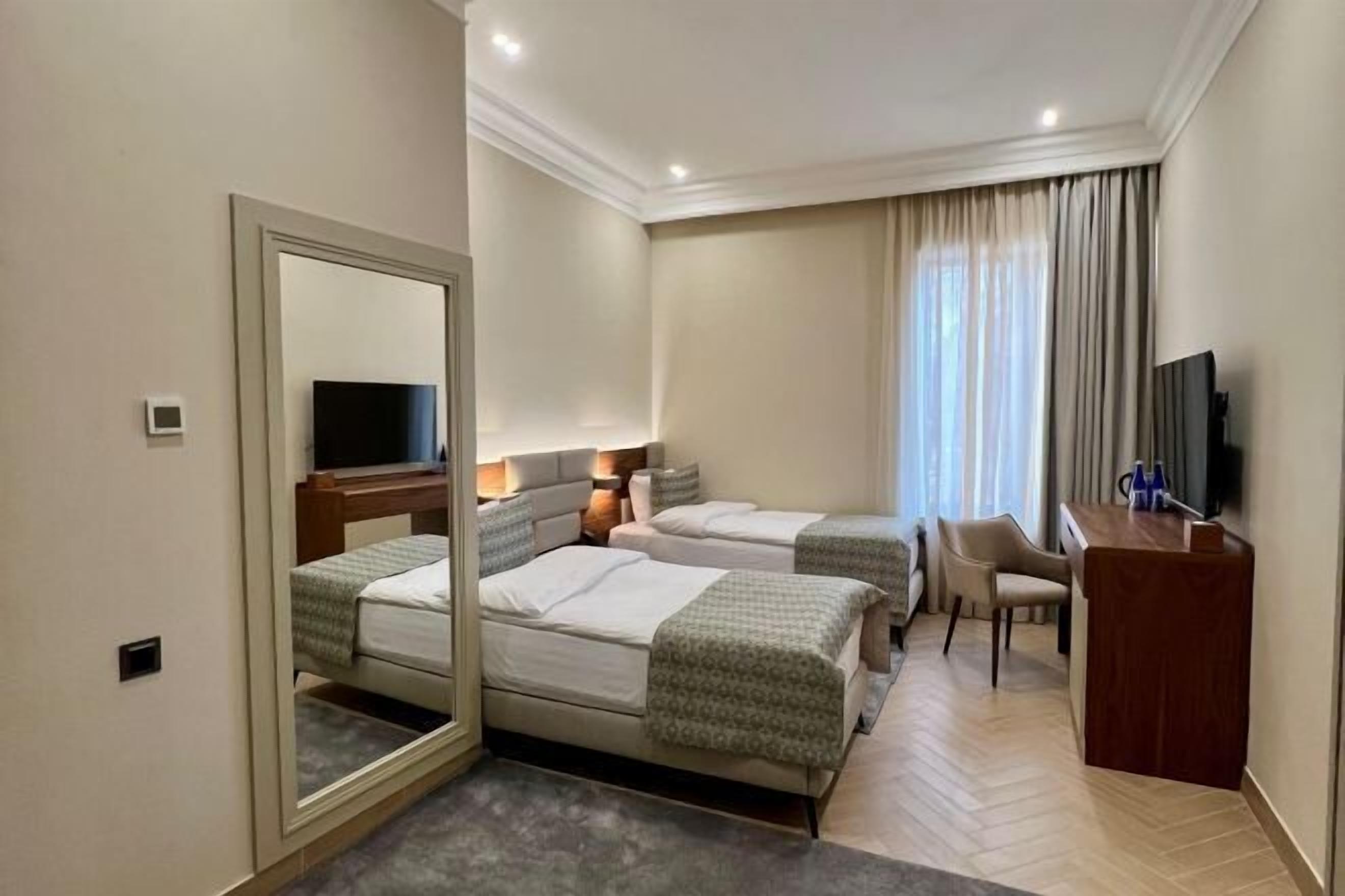 Premium bedding, memory-foam beds, in-room safe, desk