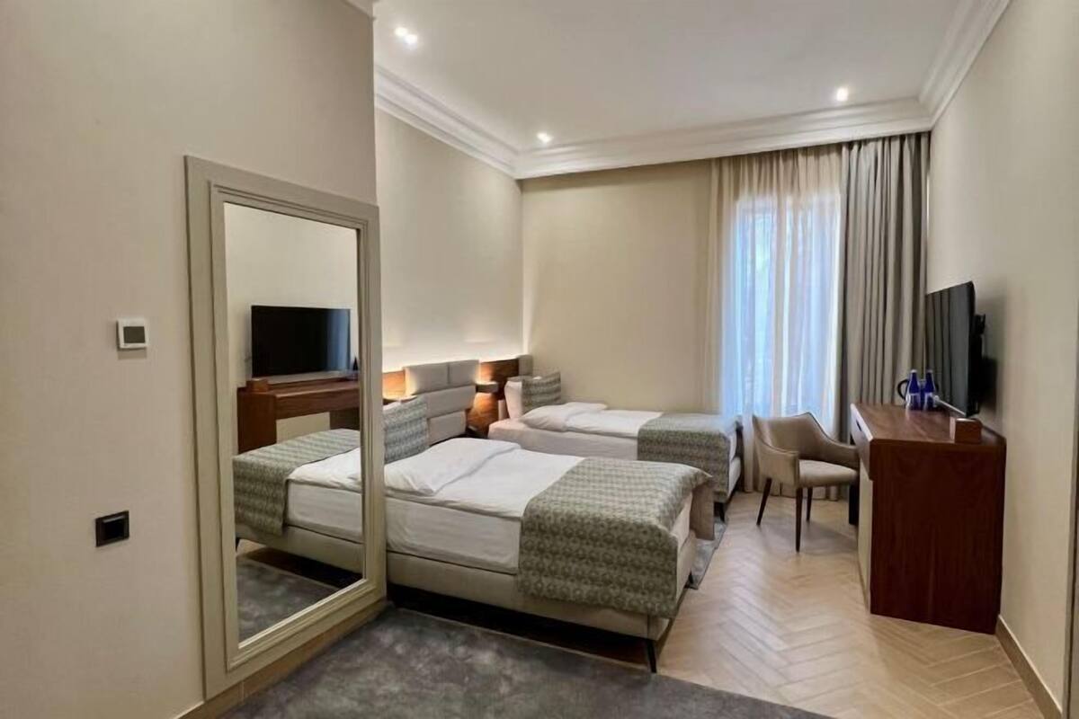 Premium bedding, memory-foam beds, in-room safe, desk