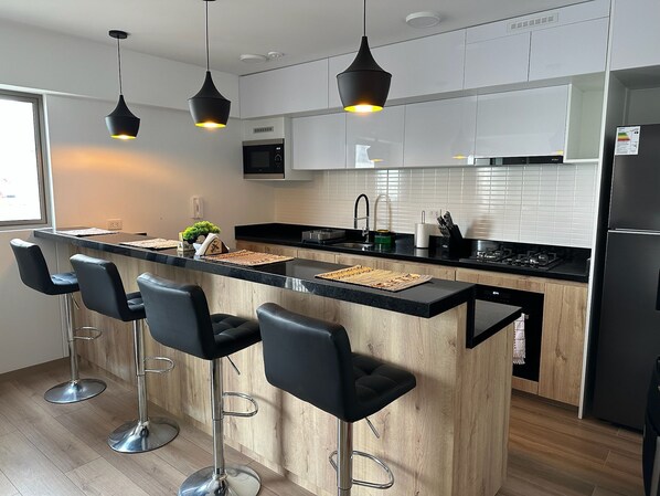 Fridge, microwave, stovetop, cookware/dishes/utensils