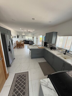 Fridge, microwave, oven, stovetop - REGATTA VIEW Newly built 3-bedroom House, Water Front Views. George Town, Exuma. (Great Exuma)