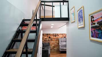 Triple Room, City View | Living area | TV, printers