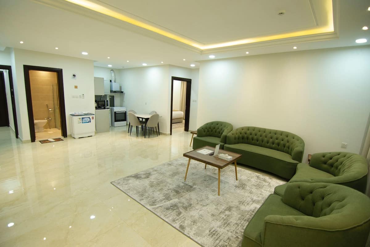 Comfort Suite, 2 Bedrooms | Living area | Flat-screen TV