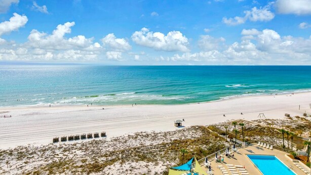 A beach resort with a swimming pool, beach access, and a lifeguard tower. - Dunes of Panama 1104e (Panama City Beach)