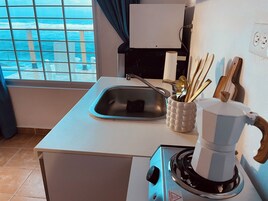 Classic Room, 1 Queen Bed, Pool Access, Sea View | Private kitchen | Mini-fridge, microwave, stovetop, dishwasher