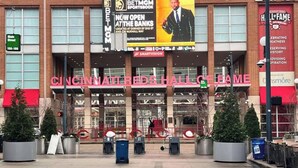 The Cincinnati Reds Hall of Fame entrance with a large sign, potted trees, and a red awning. - Walk to Bengals, Reds, Free Parking, King Bed, Gym (Cincinnati)