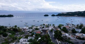 A coastal town with a marina, buildings, and a bridge. - Villas Hillside apt 3 (Samaná)