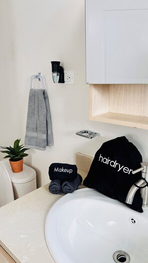 Shower, hair dryer, towels, soap