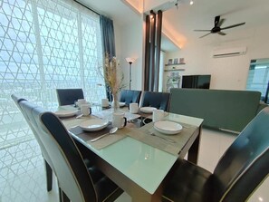 Deluxe Apartment, 4 Bedrooms, Balcony, Pool View | In-room dining