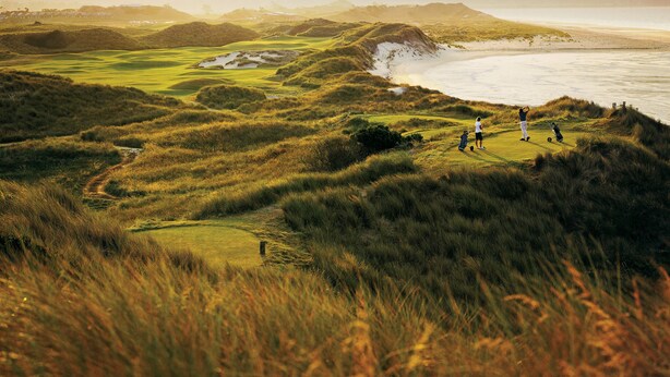A golf course with a view of the ocean and distant hills. - Leighton House, an unforgettable luxury farm stay in Northern Tasmania, Evandale (Western Junction)