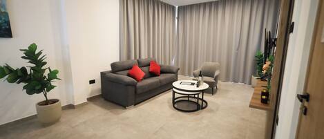 Suite exécutive, vue sur la ville | Aire de séjour