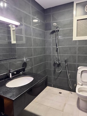 Shower, slippers, towels, soap