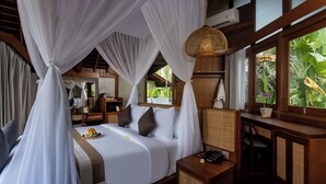 A room with a bed, bedside table, and a window with a view of greenery. - The Pulu Villas by GenuineHost (Ubud)