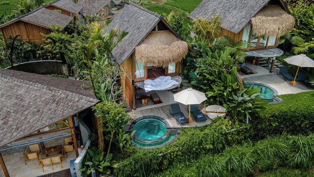A resort with thatched-roof cottages, private pools, and lush greenery. - The Pulu Villas by GenuineHost (Ubud)