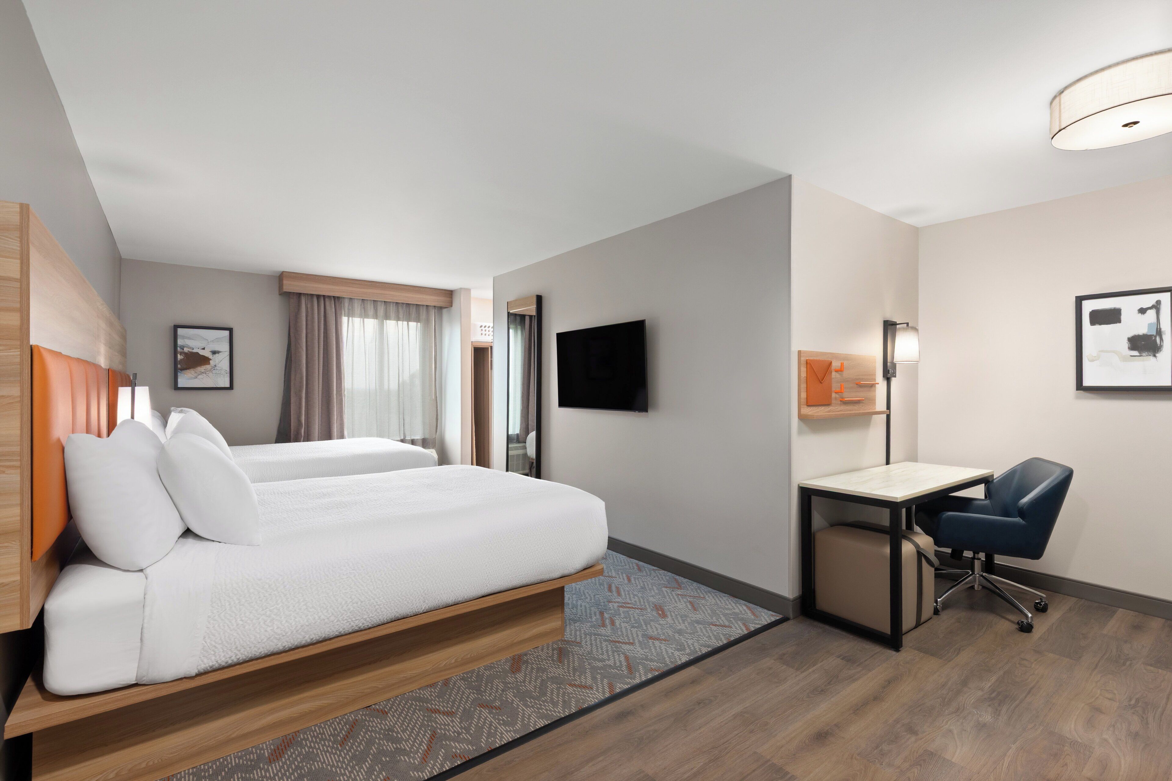 Premium bedding, pillowtop beds, desk, blackout drapes