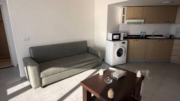 Family Suite, Balcony, Sea View | Living area | TV