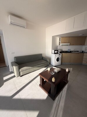 Family Suite, Balcony, Sea View | Living area | TV