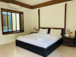 Standard Room - Ground Floor | Minibar, in-room safe, desk, iron/ironing board - LongBeach Laamu (Gan)