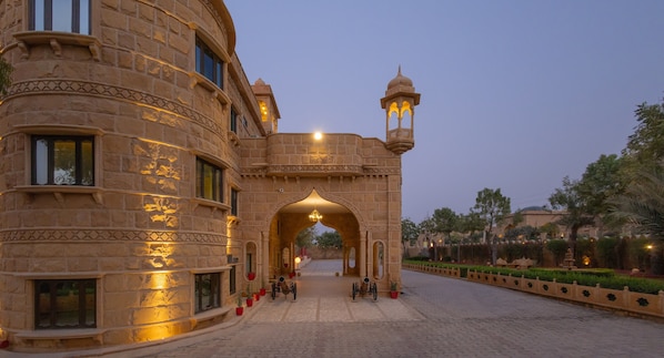 A historic building with an ornate archway and a traditional lantern.