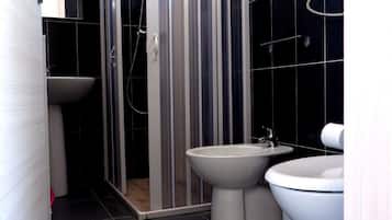 Deluxe Bungalow, Air conditioning, Beach View | Bathroom | Shower, toilet paper