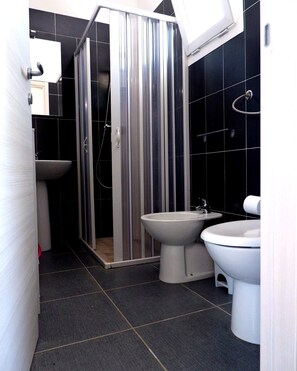 Deluxe Bungalow, Air conditioning, Beach View | Bathroom | Shower, toilet paper