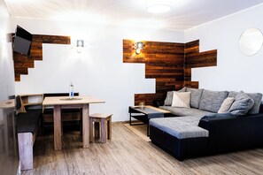 Appartement Familial, balcon, vue jardin | Coin séjour