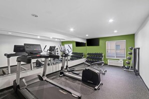 A gym with treadmills, elliptical machines, and free weights. - Spark by Hilton Killeen (Killeen)