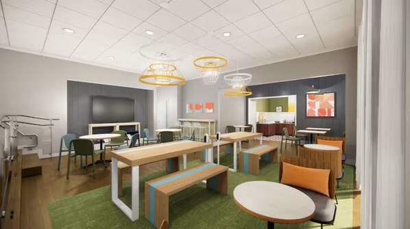 A modern, well-lit meeting room with tables, chairs, and a green carpet. - Spark by Hilton Killeen (Killeen)