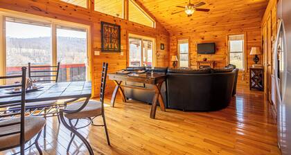 Charming riverside with stunning views, cozy interiors, full amenities, and spacious decks.