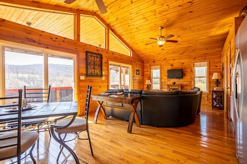 Charming riverside with stunning views, cozy interiors, full amenities, and spacious decks.