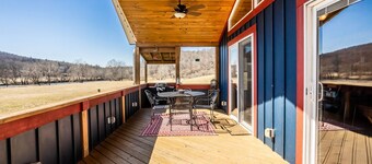 Charming riverside with stunning views, cozy interiors, full amenities, and spacious decks.