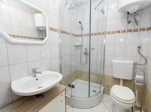 A modern bathroom with a glass-enclosed shower, a sink, and a toilet. - Beachfront Crikvenica Apartments With Sea View (Crikvenica)