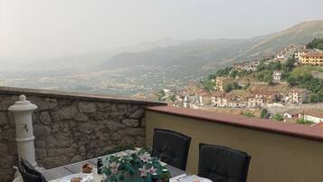 Junior Suite, City View | Terrace/patio