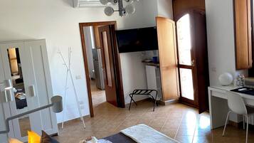 Suíte júnior, vista para a cidade | 2 quartos, frigobar (abastecido com itens grátis)