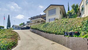 A residential street with houses, a clear sky, and a flag. - Mt. Nebo Oasis in La Mesa w/ Wraparound Deck (La Mesa)