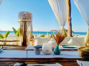 On the beach, sun loungers, beach towels