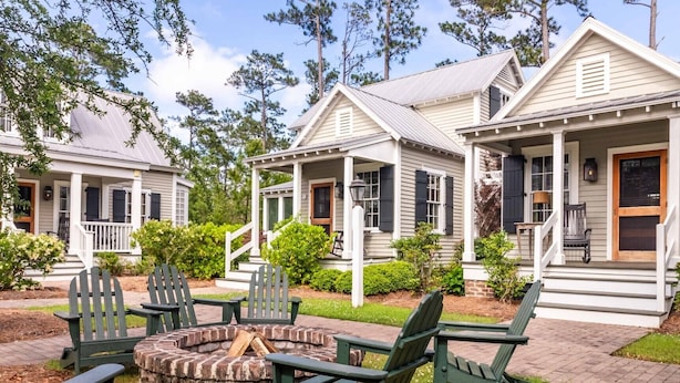 A row of cabins with a fire pit and outdoor seating. - Grand Banks Cottage w/Full Kitchen - River Dunes (Oriental)
