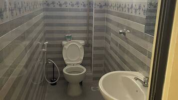 Shower, slippers, towels, soap