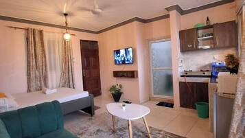 Superior Studio Suite, City View | Living area | Smart TV