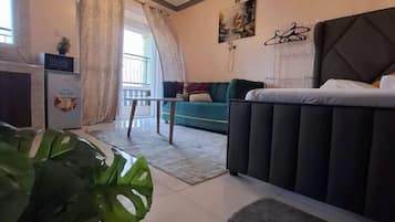 Suíte estúdio superior, vista para a cidade | 1 quarto, individualmente decorados, individualmente mobiliados