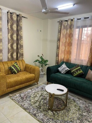 Comfort Apartment, City View | Living area | Smart TV - Lux Suites Lexy Homes Bamburi (Mombasa)