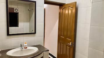 Shower, towels, soap, toilet paper