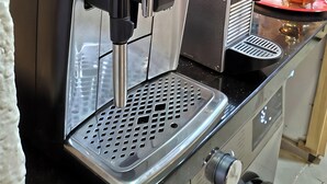 A coffee machine with a digital interface, a water reservoir, and a drip tray. - Villa Calm, Panoramic View of the Lake and Mountains, Ouarzazate Center (Ouarzazate)