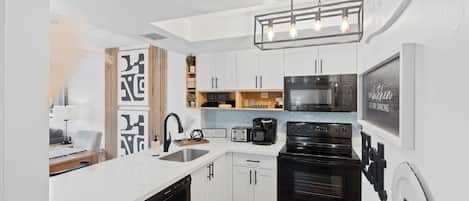 Coffee/tea maker, fridge, microwave, oven