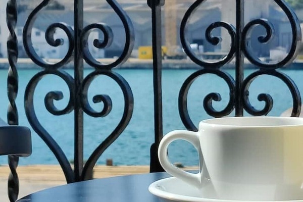 Harbour and shipyard view from the private open-air balcony in the apartment