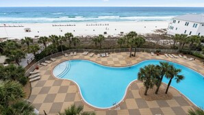 A pool area with a view of the beach and ocean. - Beautiful condo with fabulous views at Sterling Beach! Open Labor Day weeekend (Panama CIty Beach)